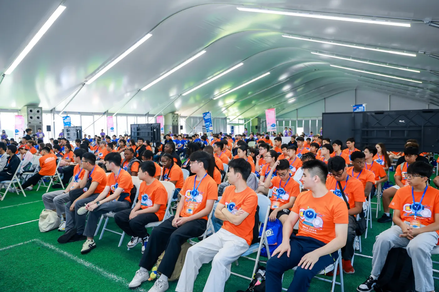 Competitors seated at the opening of the 2026 AI robotics challenge