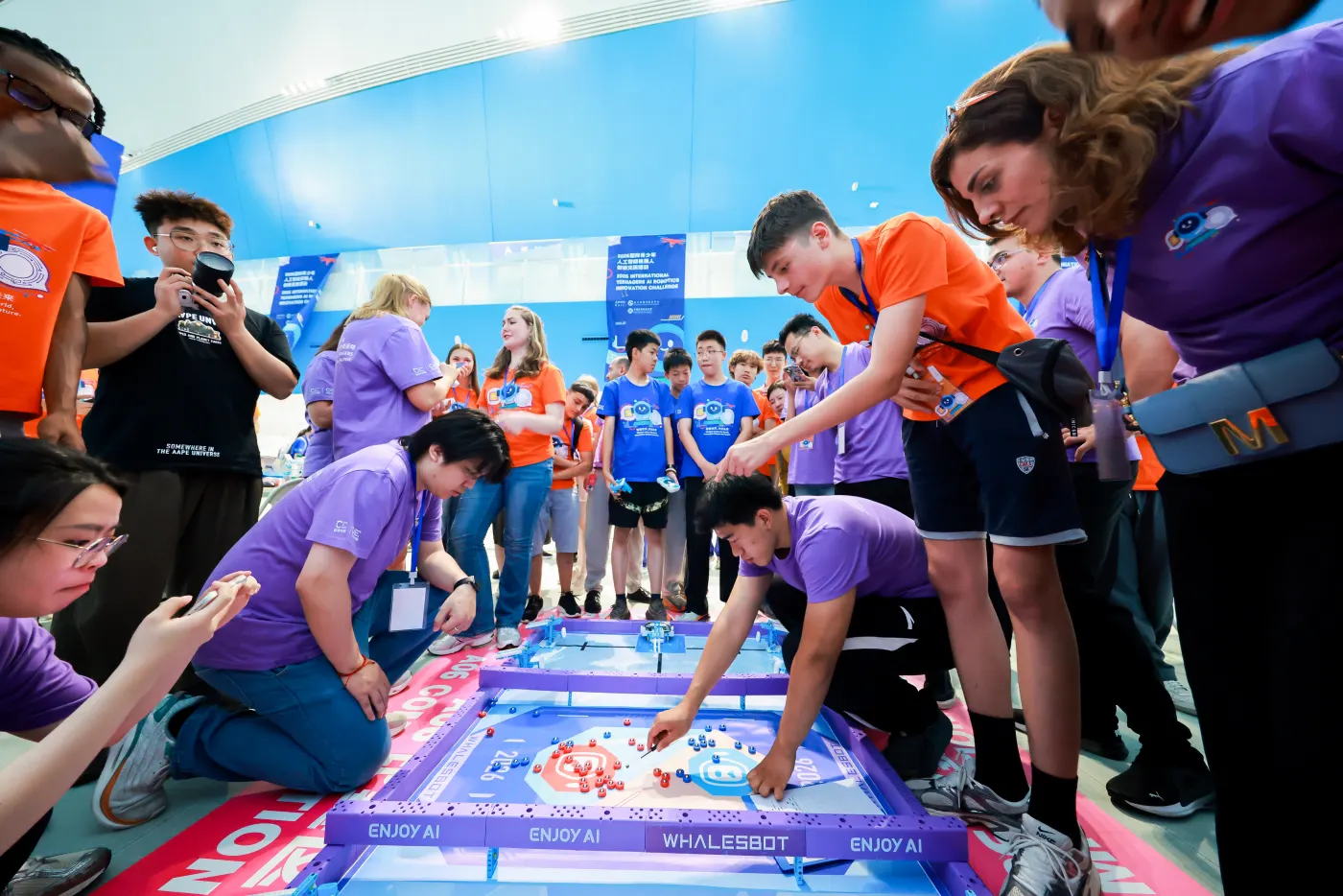 Competitors working on the robotics challenge field