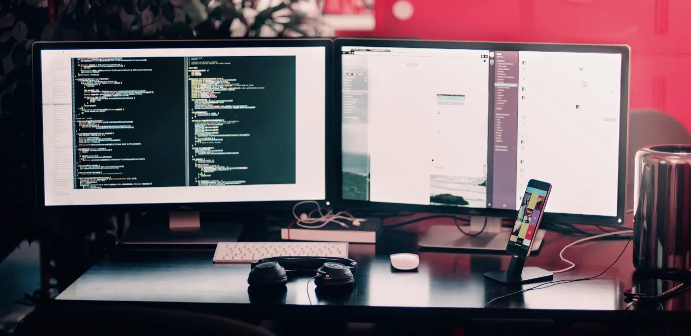 2 screens showing someone coding.